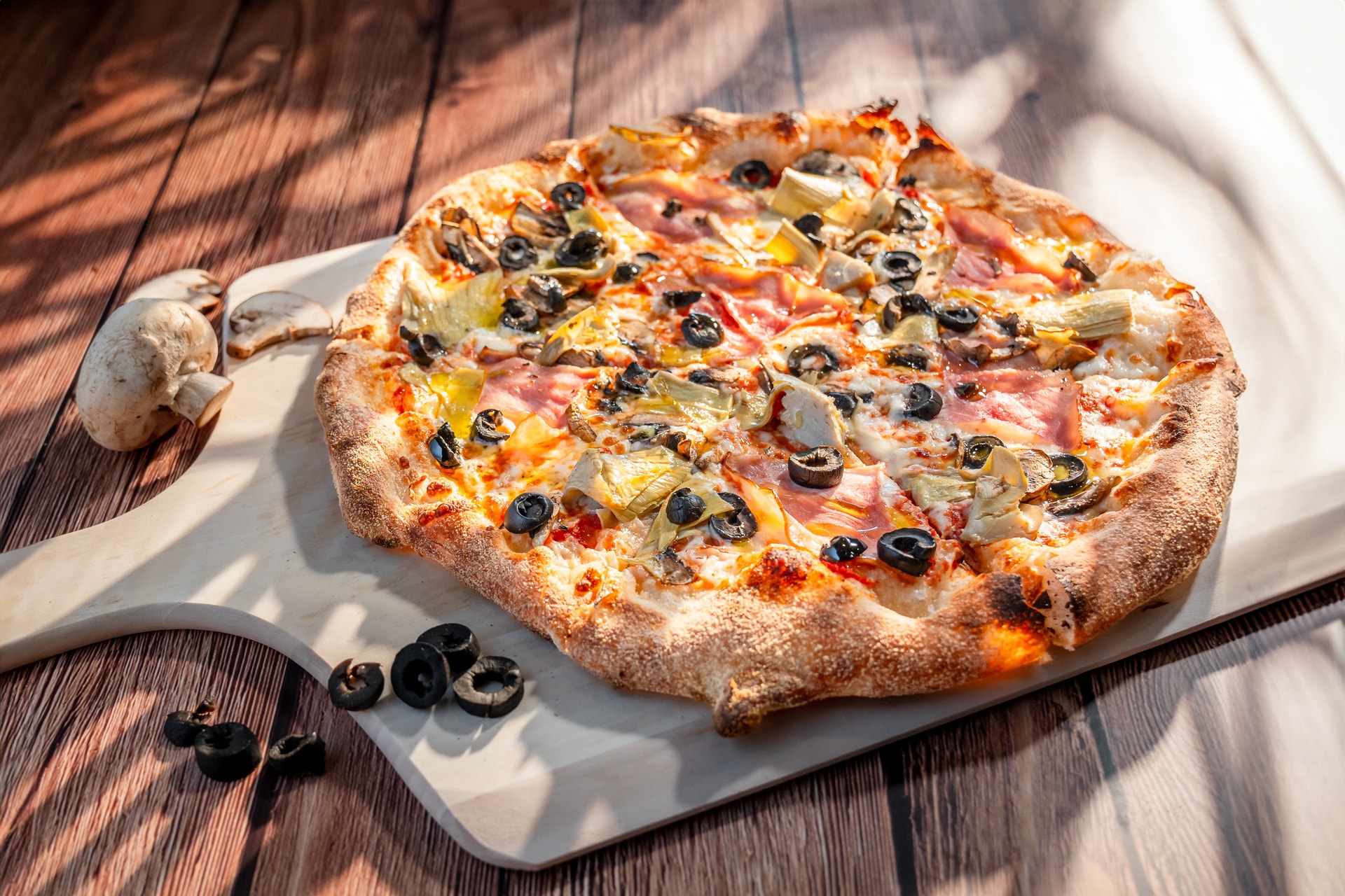 Wood-fired pizza on paddle